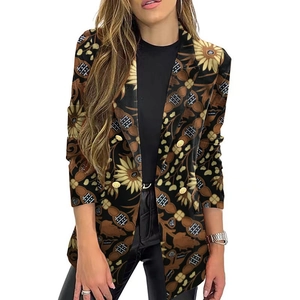 Detail of floral sunflower pattern and gold double-breasted buttons on a slim blazer
