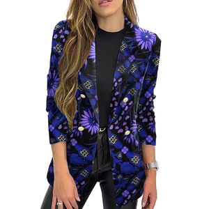 Close-up of vintage floral print blazer with gold double-breasted buttons and notch lapel