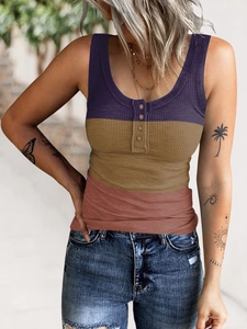 Detail of ribbed knit texture on a color-block henley tank top with button neckline