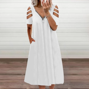 Detail view of white V-neck dress featuring a metal zipper and cold shoulder cut-out sleeves