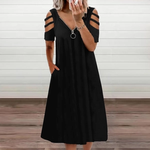 Detail of black V-neck dress with zipper, cold shoulder sleeves and side pockets