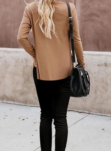 Detailed texture of the ribbed knit fabric on a camel long sleeve cardigan for women