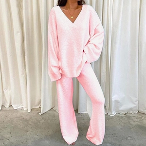Cozy pink fleece lounge set with V-neck top and warm loose pants for winter comfort