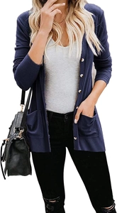 Detail of navy knit cardigan featuring white buttons and large symmetrical side pockets