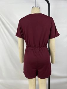 Back view of wine red V-neck romper with elastic waist and ribbed knit texture