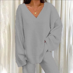 Detail of plush grey fleece lounge set showing V-neck texture and soft thick fabric