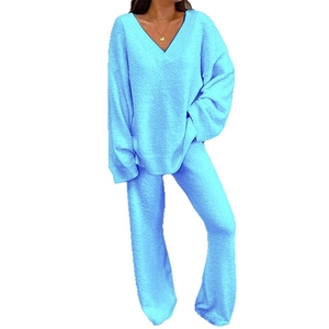 Women's two-piece winter loungewear set featuring V-neck plush top and flared pants in light blue