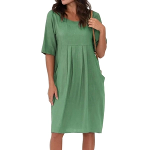 Detailed view of casual green linen dress featuring pleated texture and side pockets