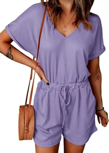 Close-up of lilac ribbed V-neck romper featuring a drawstring elastic waist and pockets