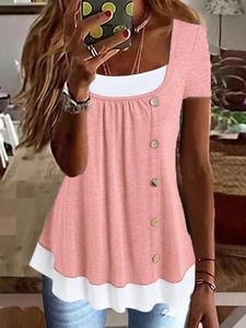 Detail of pink faux two-piece top with vertical wooden buttons and double-layer white hem