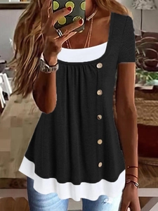 Detailed view of black and white layered short sleeve top with stylish side button accents