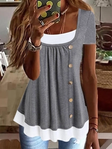 Detail of grey short sleeve tee featuring a faux two-piece design with wooden buttons