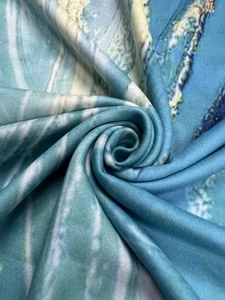 Detailed view of soft flannel fabric with blue geometric abstract artistic print pattern