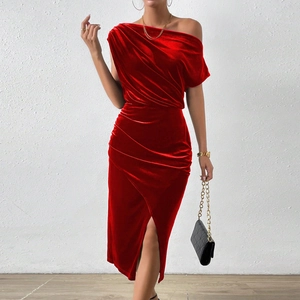 Detail of red velvet off-shoulder dress featuring side slit and elegant draped texture