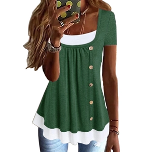 Detail of dark green short sleeve top with layered white hem and wooden texture buttons