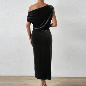 Rear view of sleek black velvet off-shoulder maxi dress with elegant slim fit design