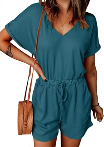 Detail of teal ribbed v-neck romper featuring rolled sleeves and a drawstring waist