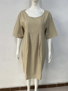 Detail of khaki cotton linen dress featuring pleated waist and round neckline design