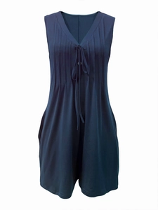 Detail of dark blue V-neck romper with vertical pleats and drawstring chest accents