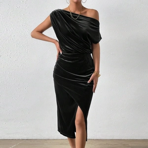 Detail of elegant black velvet one-shoulder dress showing texture and high side slit
