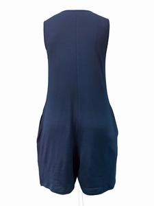 Rear view detail of sleeveless navy blue romper with functional pockets and knit texture