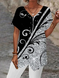 Detail of V-neck loose T-shirt with black and white geometric scroll floral print