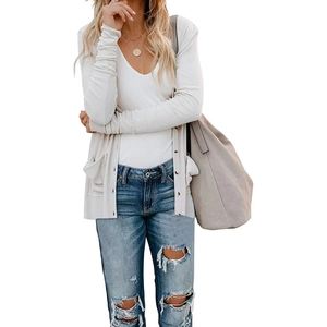 Women's cream white loose knit cardigan with deep V-neck and front pockets