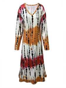 Detailed view of the V-neckline and tie-dye pattern on long-sleeve maxi dress fabric