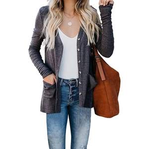 Women's dark grey ribbed knit cardigan with pockets, paired with jeans and brown tote bag