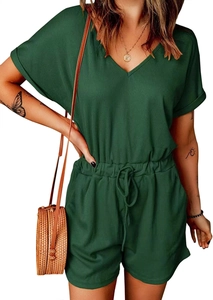 Detail of dark green ribbed romper with V-neck, elastic waist, and tie-belt for summer