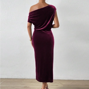 Detailed back view of a burgundy velvet dress showing texture and shoulder detail