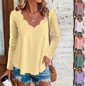 Close-up of scalloped V-neck detail and hollow eyelet embroidery on long sleeve top