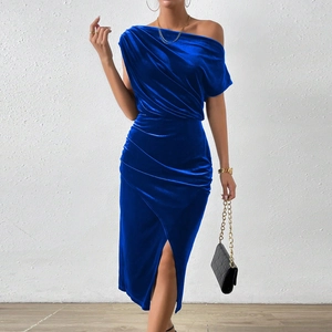 Detail of royal blue velvet dress featuring elegant off-shoulder neckline and side ruffles