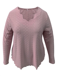 Detail of scallop V-neckline and intricate geometric lace texture on pink long sleeve top
