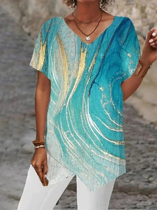 Detailed view of women's V-neck t-shirt featuring blue and gold marble geometric patterns
