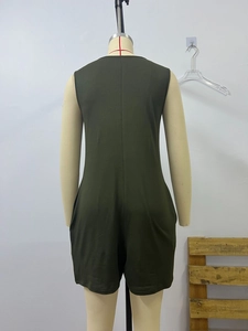 Back view of a sleeveless dark green knit romper on a mannequin with seam details