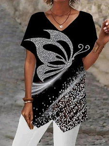 Detail view of V-neck T-shirt with silver glitter butterfly print on black fabric
