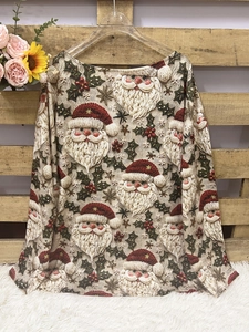 Detailed close-up of a long-sleeve V-neck pullover with festive Santa Claus all-over print