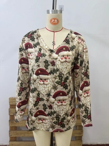 Detail of Christmas Santa print V-neck long sleeve top on a professional tailor mannequin