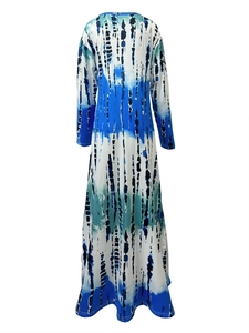 Detail of blue and green tie-dye pattern on long sleeve V-neck maxi dress fabric