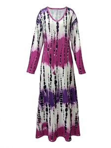 Detail of V-neck maxi dress featuring vertical pink and purple tie-dye print and long sleeves
