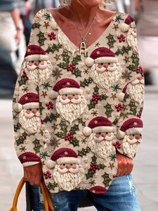 Women's V-neck long sleeve top featuring festive Santa Claus and holly berry prints