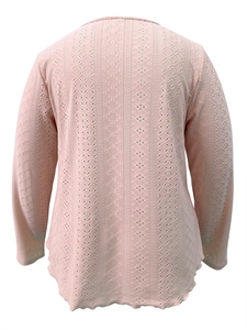Detail of light pink long sleeve top showing vertical eyelet lace texture and scalloped hem
