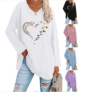 Detail view of women's V-neck long sleeve shirt featuring heart leopard butterfly print