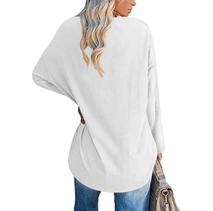 Back view of loose fit long sleeve white top with heart print and curved hem detail