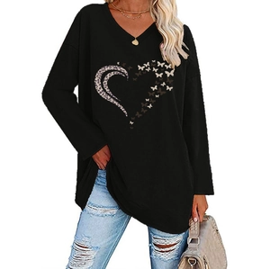 Detail of V-neck top featuring leopard print heart and butterfly graphic design