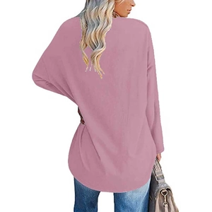 Detail view of the back of a loose-fit heart print sweatshirt with dropped shoulders