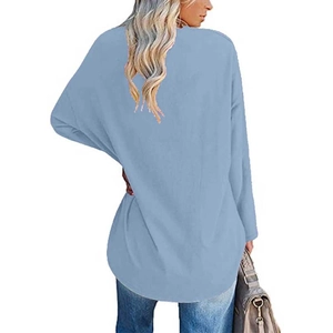 Detail view of light blue heart print long sleeve top showing relaxed fit and back drape