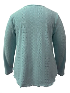 Detailed back view of light blue long-sleeve top featuring intricate hollow-out knit patterns