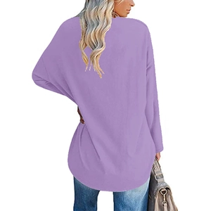 Detail view of the loose curved back hem of this casual purple long sleeve heart top